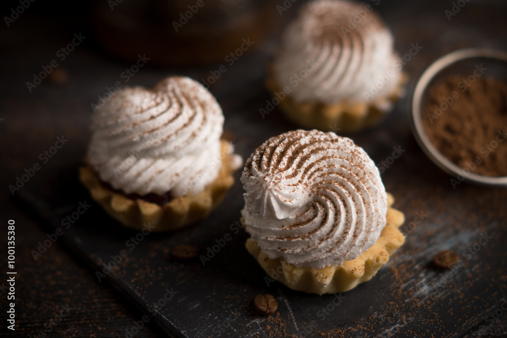 Creamy cake on the dark rustic background. Shallow depth of field. Creamy cake on the dark rustic background. Shallow depth of field.