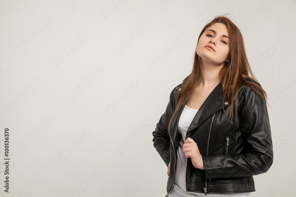 Glamorous woman in black leather jacket isolated on white background Glamorous woman in black leather jacket isolated on white background