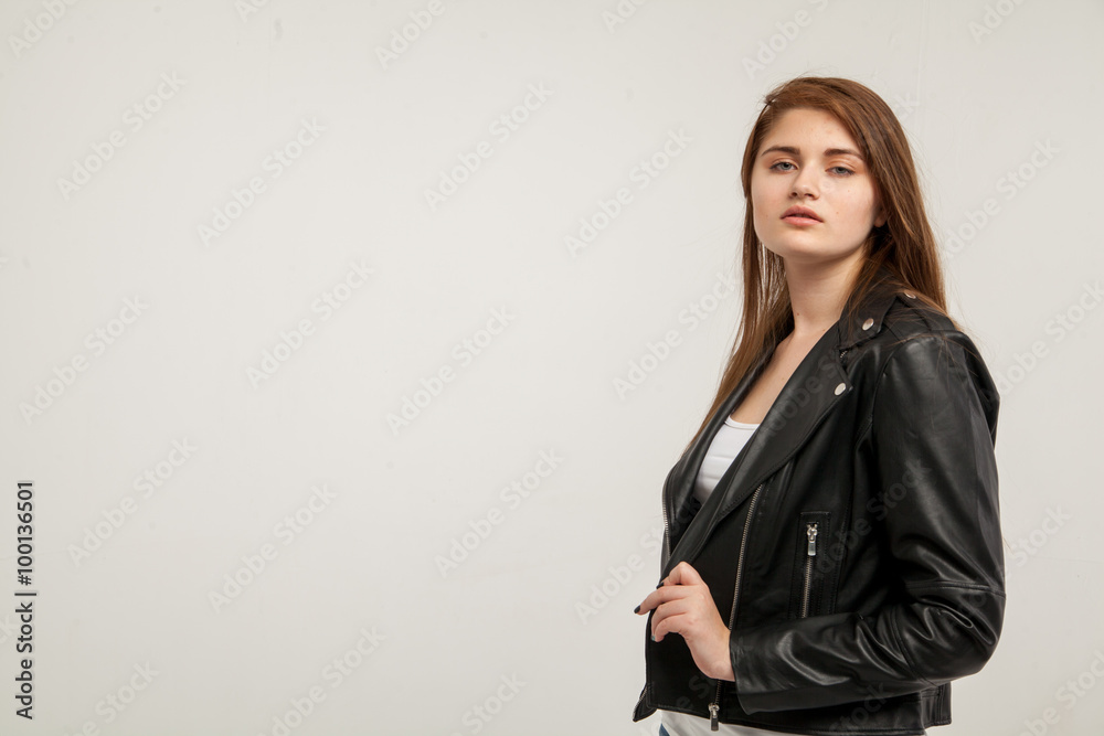 Glamorous woman in black leather jacket isolated on white background Glamorous woman in black leather jacket isolated on white background