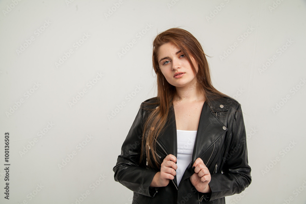 Glamorous woman in black leather jacket isolated on white background Glamorous woman in black leather jacket isolated on white background