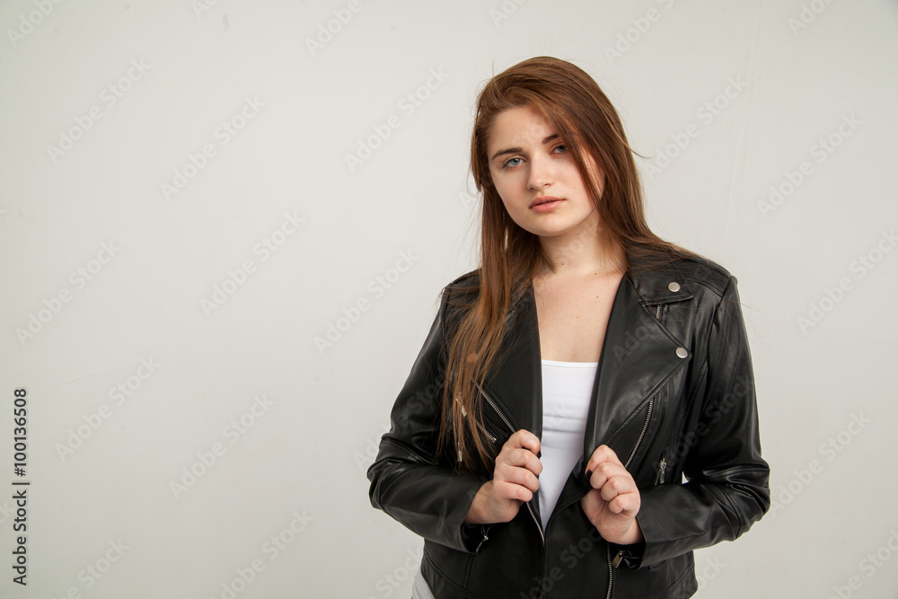 Glamorous woman in black leather jacket isolated on white background