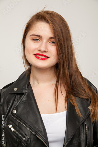 Glamorous woman in black leather jacket isolated on white background