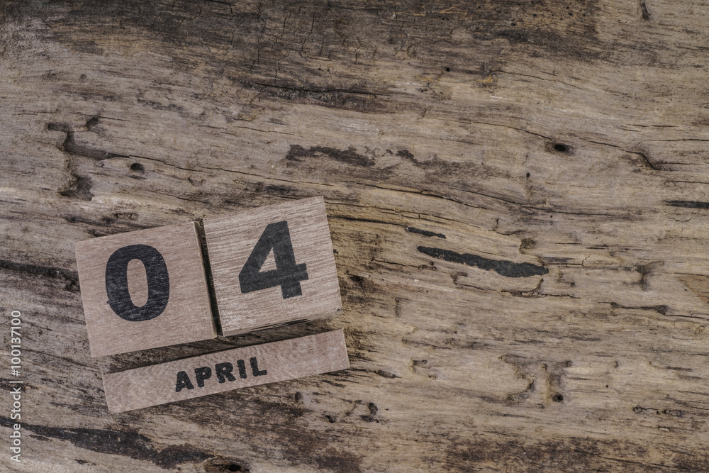 cube calendar on wooden surface for april with copy space cube calendar on wooden surface for april with copy space