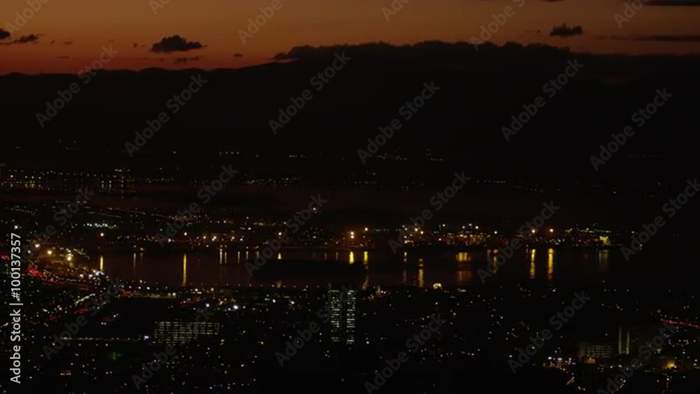 Pan over Rio de Janeiro's waterfront at night with cityscape