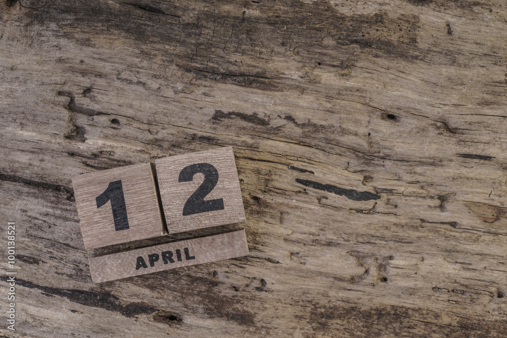 cube calendar on wooden surface for april with copy space cube calendar on wooden surface for april with copy space