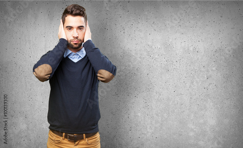 cool man covering his ears