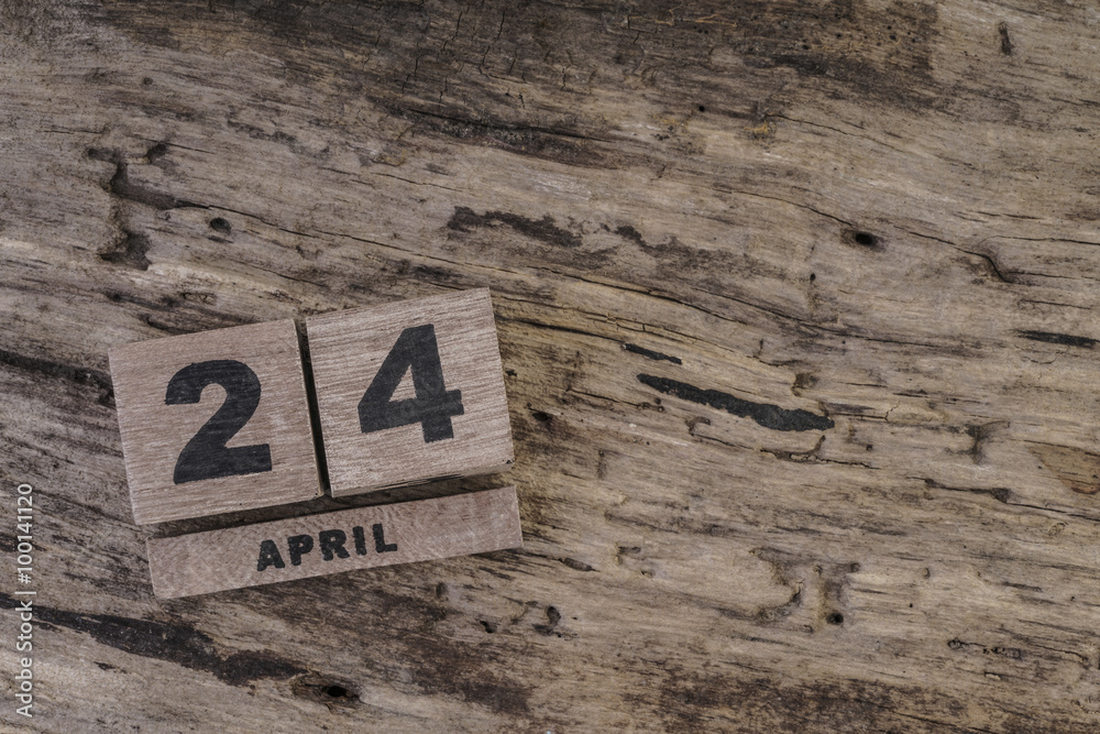 cube calendar on wooden surface for april with copy space cube calendar on wooden surface for april with copy space