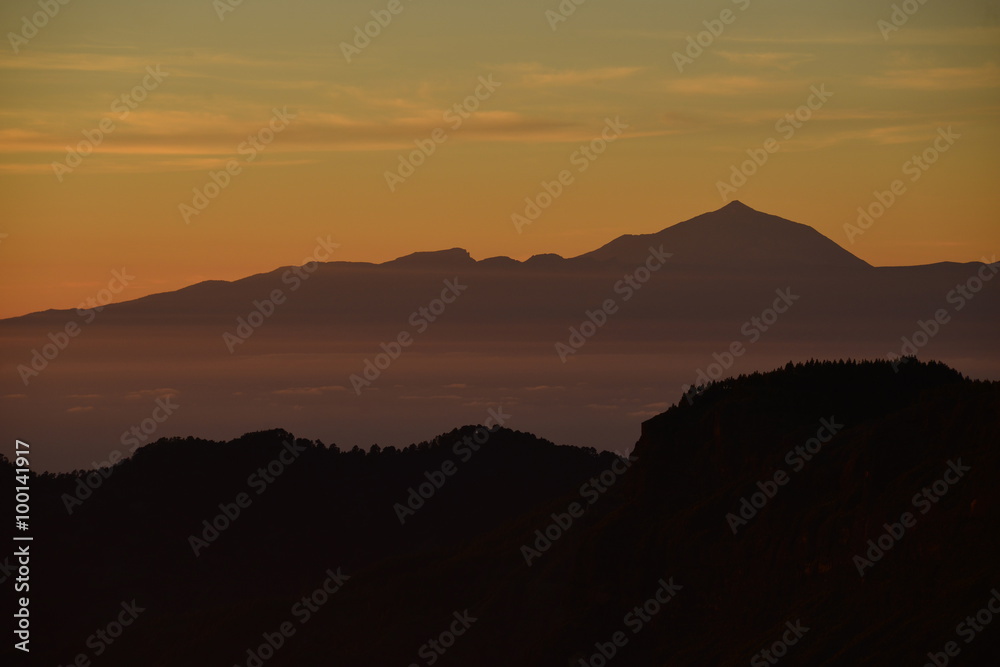 Pico Del Teide, Tenerife, Spain. Telephoto sunset image of the volcano and highest peak in Spain at 3716 metres. Pico Del Teide, Tenerife, Spain. Telephoto sunset image of the volcano and highest peak in Spain at 3716 metres.