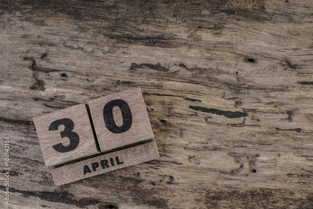 cube calendar on wooden surface for april with copy space cube calendar on wooden surface for april with copy space