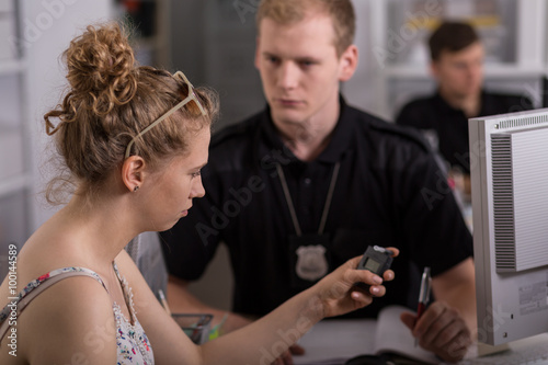 Young woman holding breathalyzer