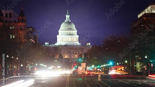 Time lapse of the US Captiol at night with flares. photo