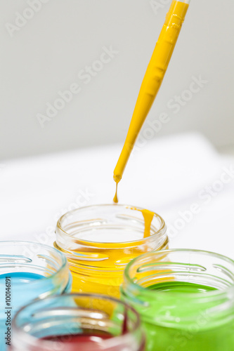 Colorful paints in jars