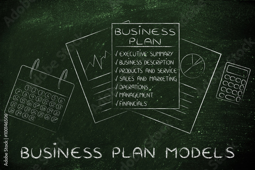 business plan & stats documents on office desk, with text Busine