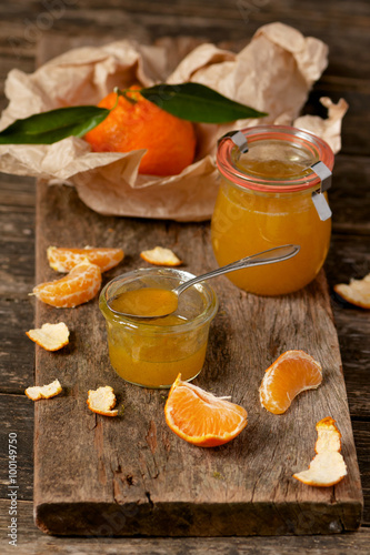 Mandarin vanilla homemade marmalade in jars. Selective focus.

