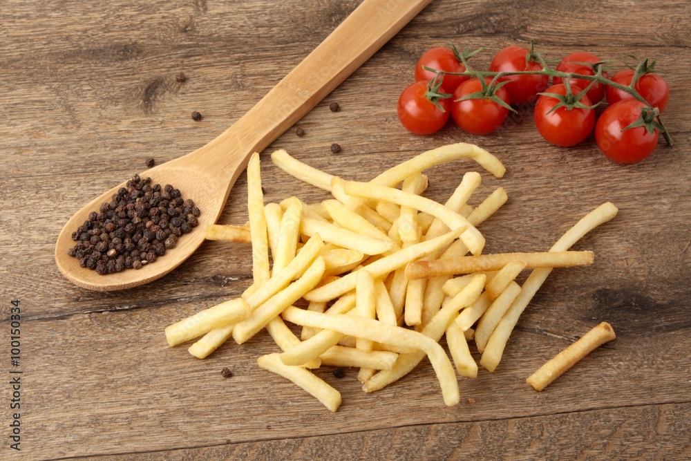 French fries on a wooden background