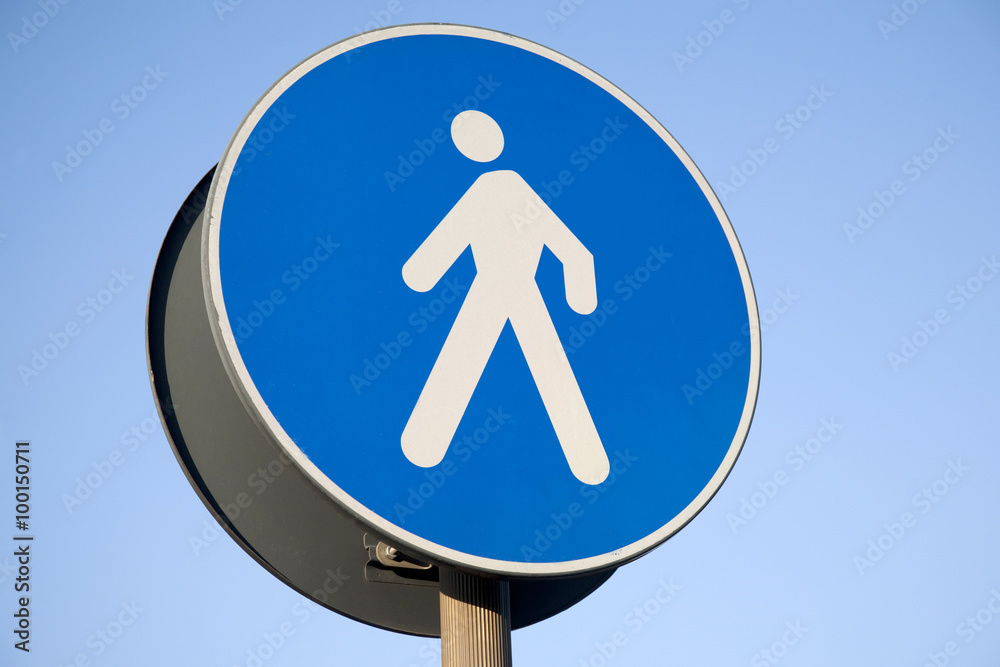 Pedestrian Sign against Blue Sky Background Pedestrian Sign against Blue Sky Background