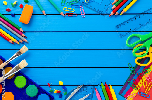School supplies on blue wooden table