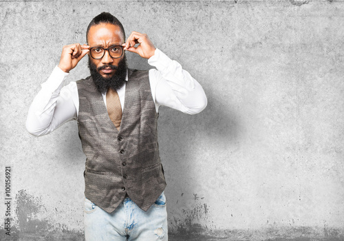 business black man holding his glasses