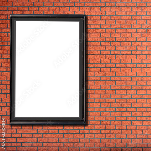 One blank billboard attached to a buildings brick wall