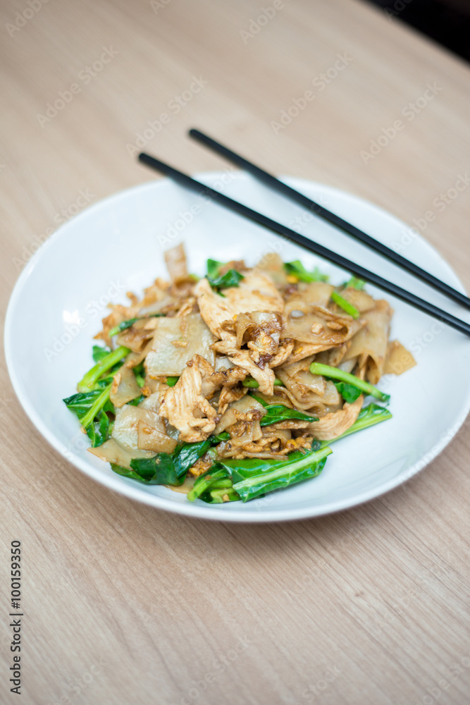 Asian stir fried flat rice noodles. Pad se ew with chicken