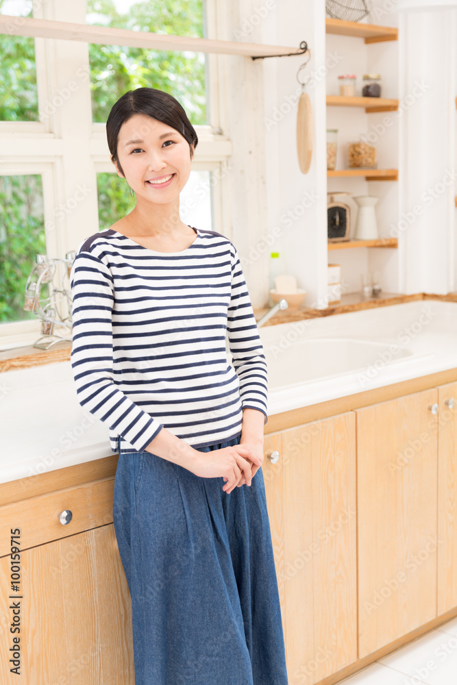 attractive asian woman in the kitchen