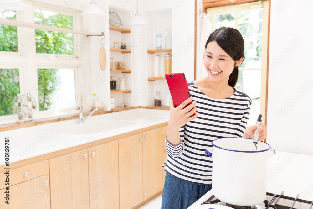 attractive asian woman in the kitchen attractive asian woman in the kitchen
