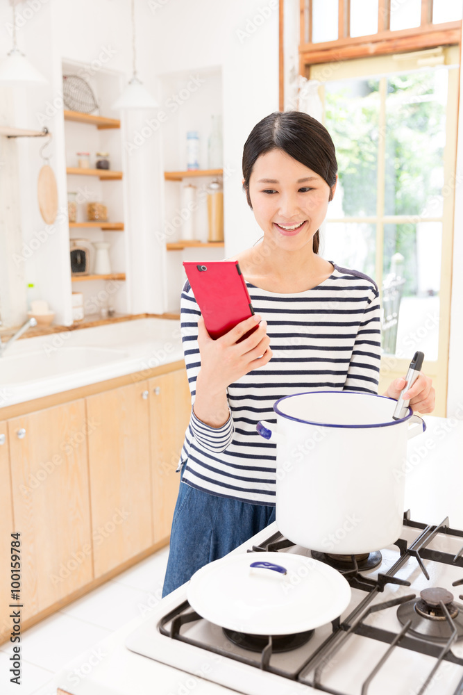 attractive asian woman in the kitchen attractive asian woman in the kitchen
