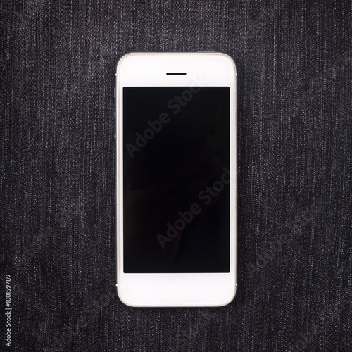 white mobile phone on pocket with black screen