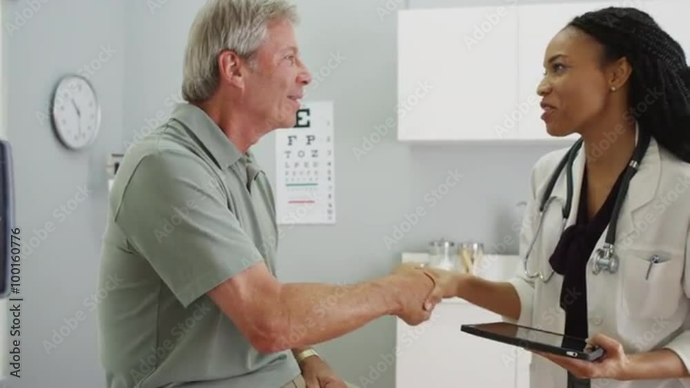Senior patient being greeted by friendly doctor Senior patient being greeted by friendly doctor