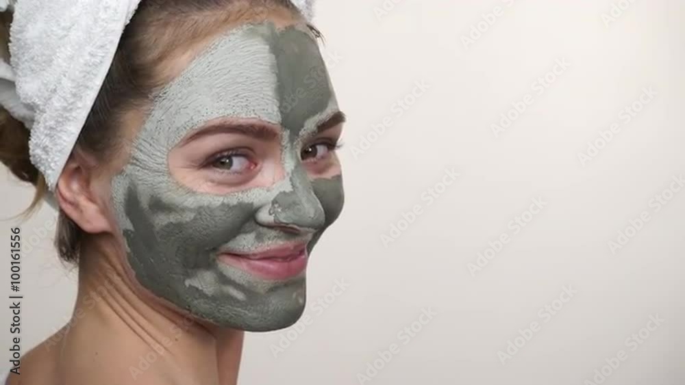 Woman with green clay mud mask on face 4K Woman with green clay mud mask on face 4K