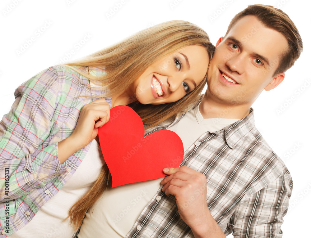 Happy couple in love holding red heart Happy couple in love holding red heart