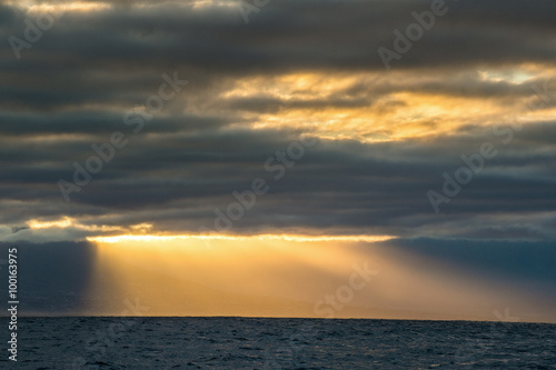 Cloudscape, Dramatic Clouds at Sunset near the Mountains in the Ocean