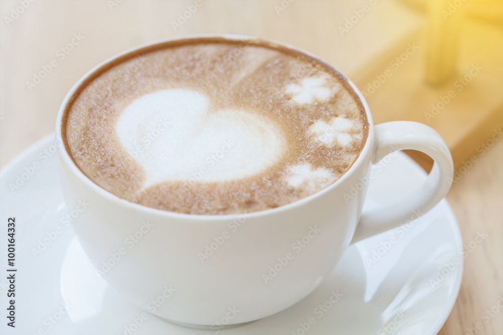 heart symbol on latte coffee cup on table heart symbol on latte coffee cup on table