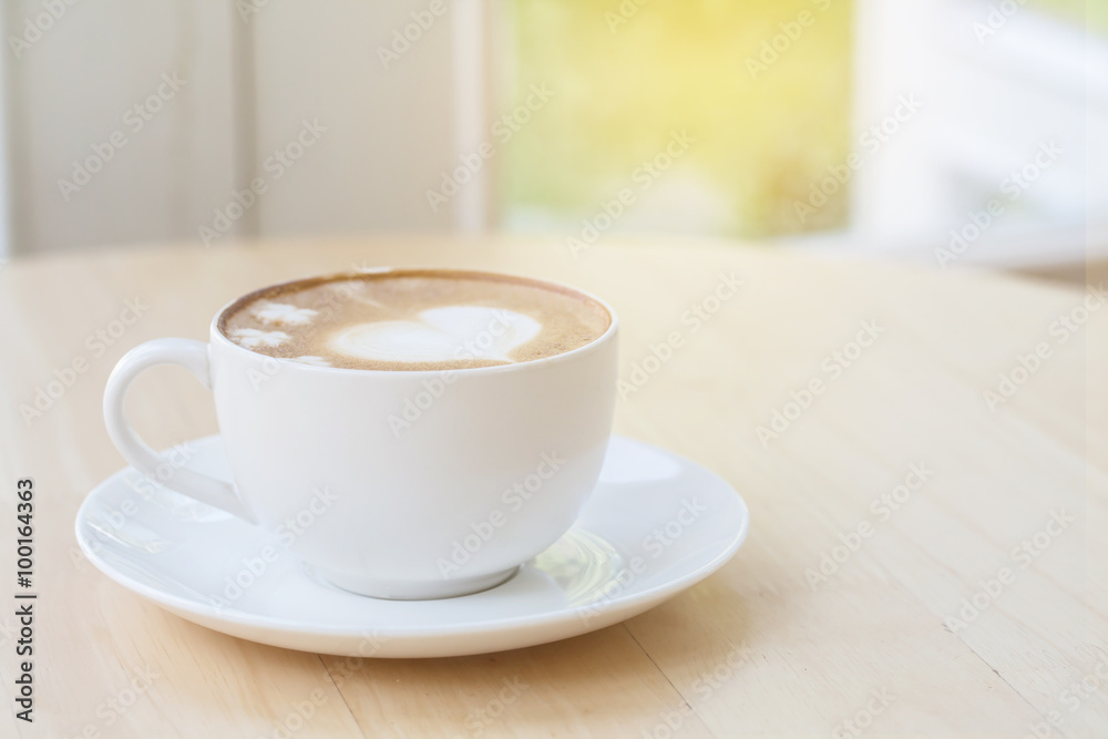 heart symbol on latte coffee cup on table heart symbol on latte coffee cup on table