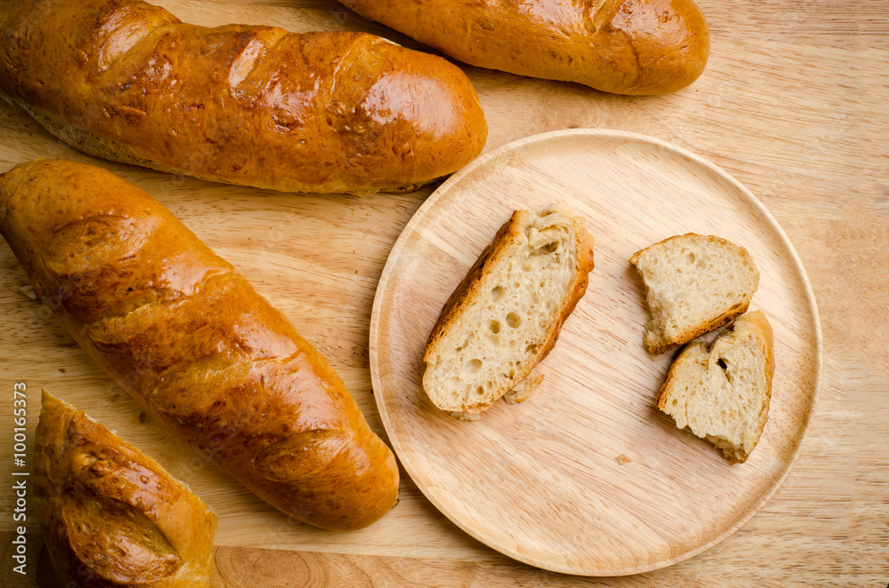 Fresh bread on wooden background Fresh bread on wooden background