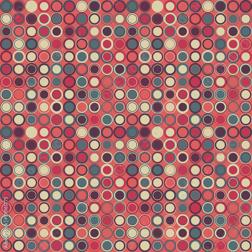 Vector seamless pattern. Consists of geometric elements arranged on red background.The elements have a circular shape and different color.