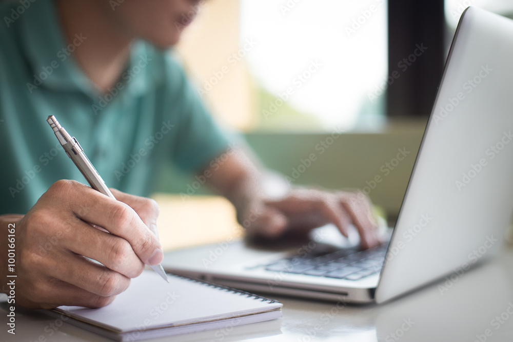 working on laptop, close up of hands of business man working on laptop, close up of hands of business man