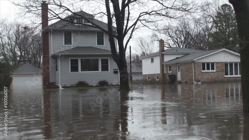 House owner fight with flood due to overflowing Des Plaines River after heavy rainfalls 3. At that time Flood stage in this area was 9.6ft, major flooding stage is 9.0ft.