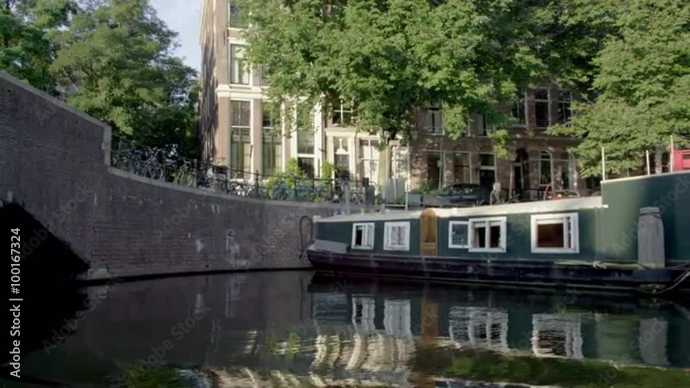 Shot of boats and houseboats along the embankment in Amsterdam Shot of boats and houseboats along the embankment in Amsterdam