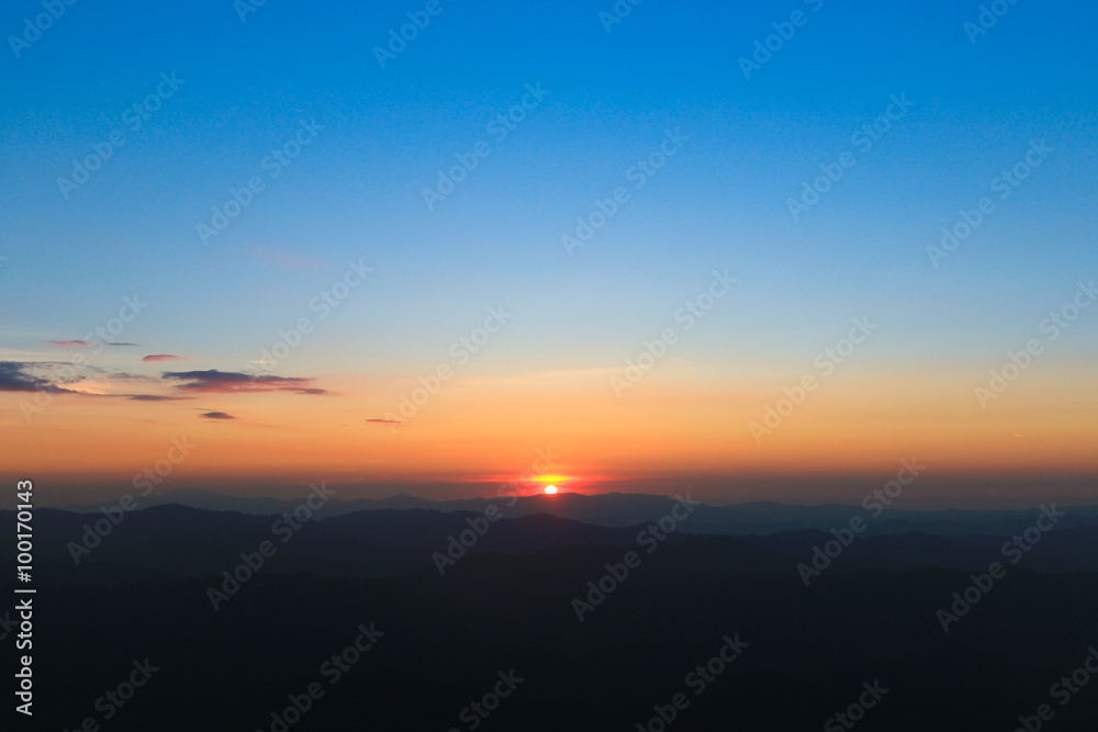 Mountain valley during sunrise.