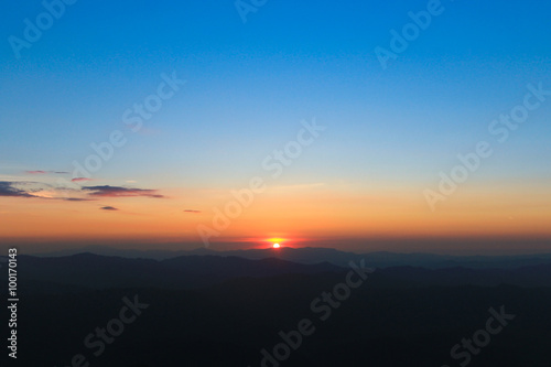 Mountain valley during sunrise.