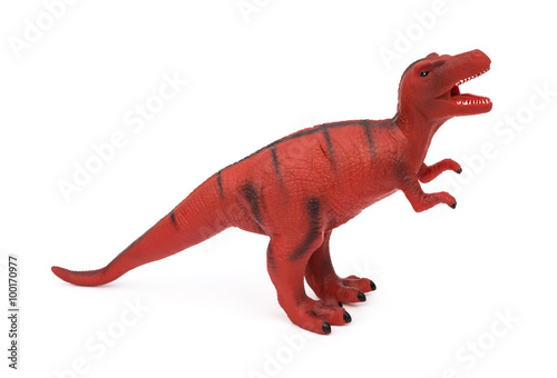red tyrannosaurus toy on a white background