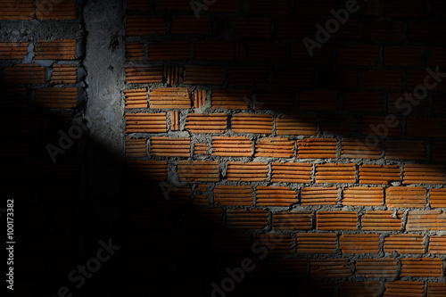 brick wall in residential construction site with light sunshine