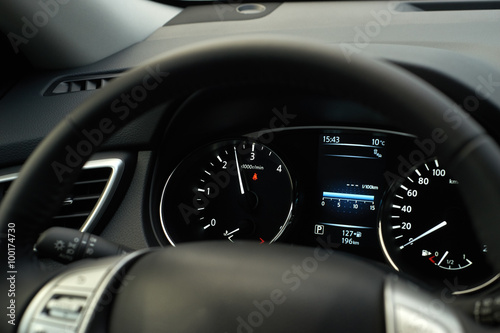 Modern car speedometer and illuminated dashboard