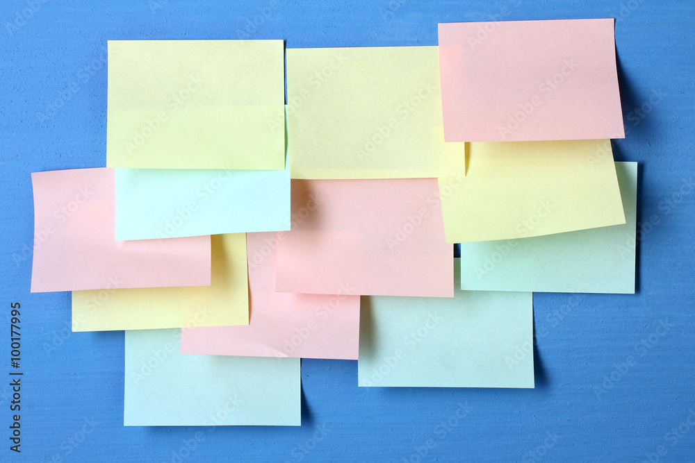 colored paper stickers glued on a wooden Board with place for text colored paper stickers glued on a wooden Board with place for text
