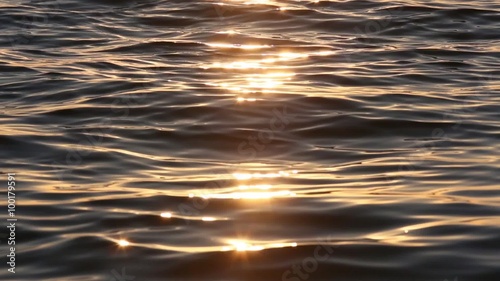Sun track on lake water surface. Nature sunset background.
