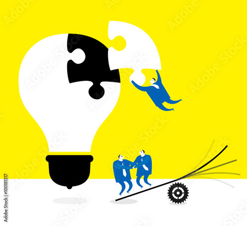 Team work : The key point. / Three businessmen collaborate to finish a puzzle of idea.