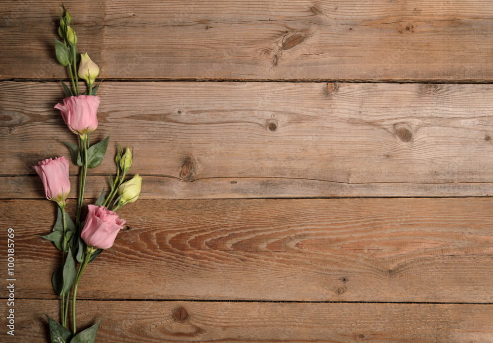 Beautiful eustoma on wooden background Beautiful eustoma on wooden background