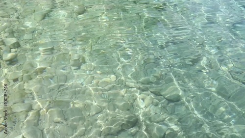 Wallpaper Mural Summer sea bottom view (with stones) through limpid water and sun reflection on surface.
 Torontodigital.ca