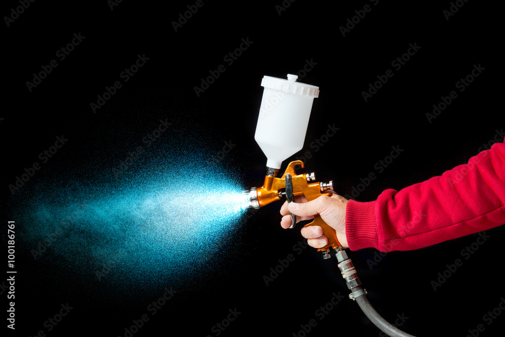 Naklejka premium airbrush paint sprayer isolated on black